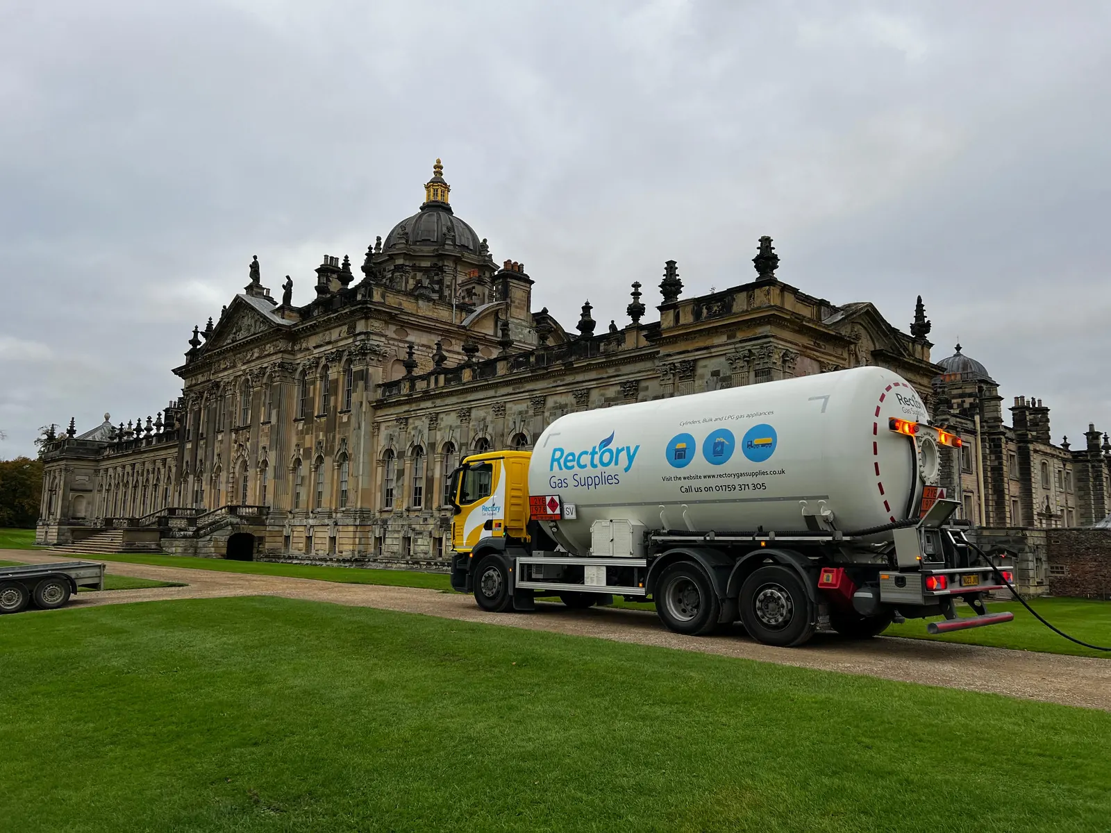 A Rectory Gas Supplies tanker parked on the drive in front of a historic stately home